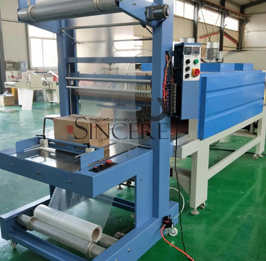 Shrink wrapping machine